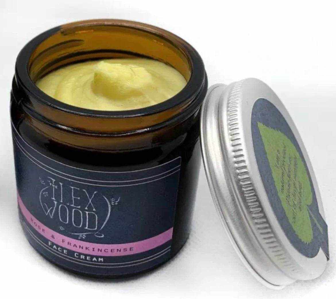 Rose and Frankincense Face Cream in brown glass jar with silver lid, natural anti-aging vegan moisturizer.