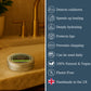 Metal tin with lip balm on a wooden surface, with product features listed on the right.