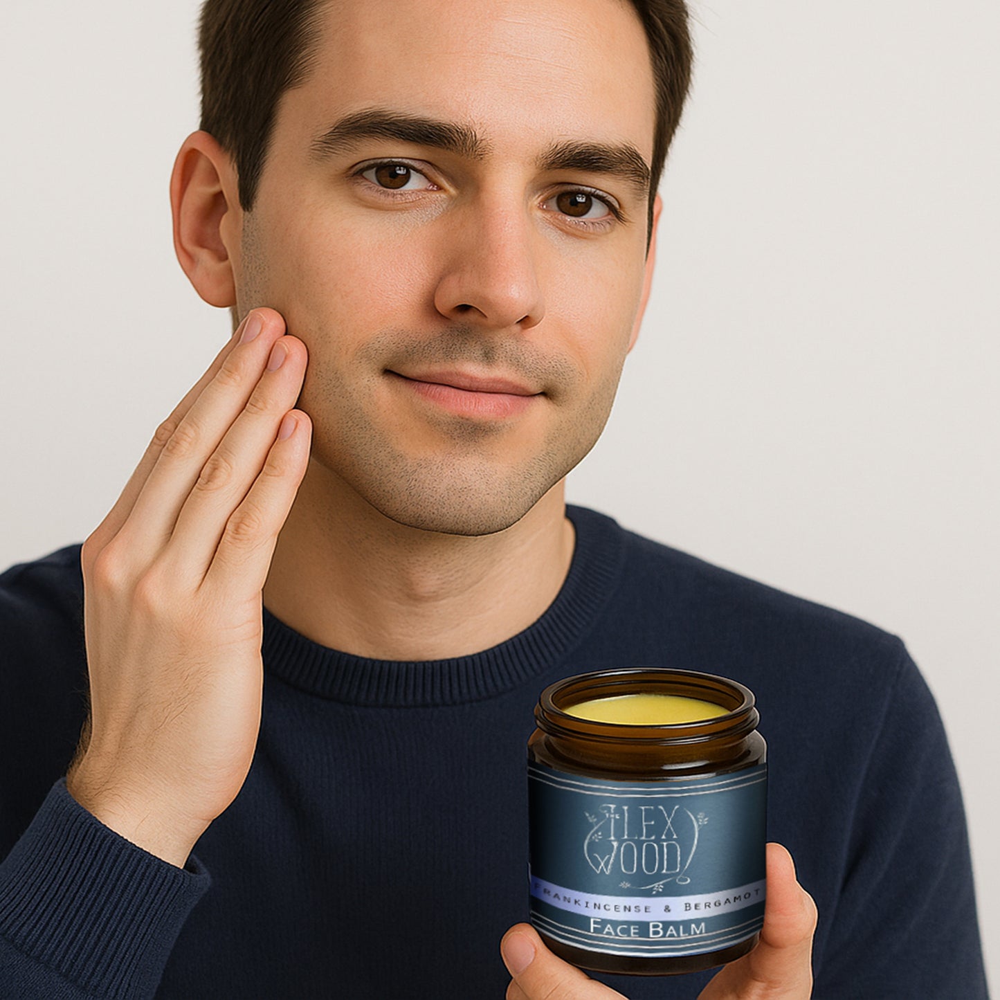 Man using Frankincense and Bergamot Face Balm in a bathroom