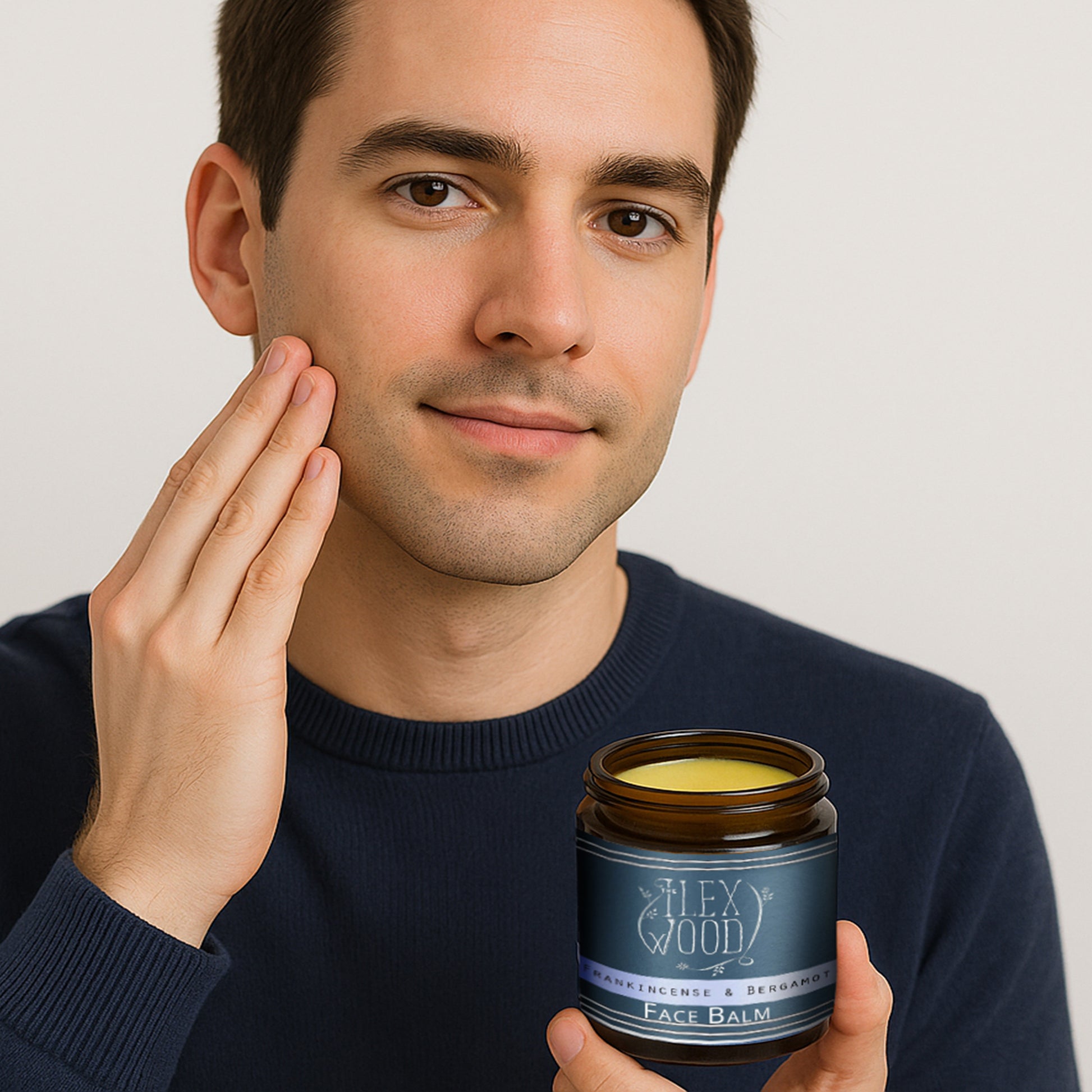 Man using Frankincense and Bergamot Face Balm in a bathroom