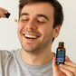 man applying Frankincense and Bergamot Facial serum