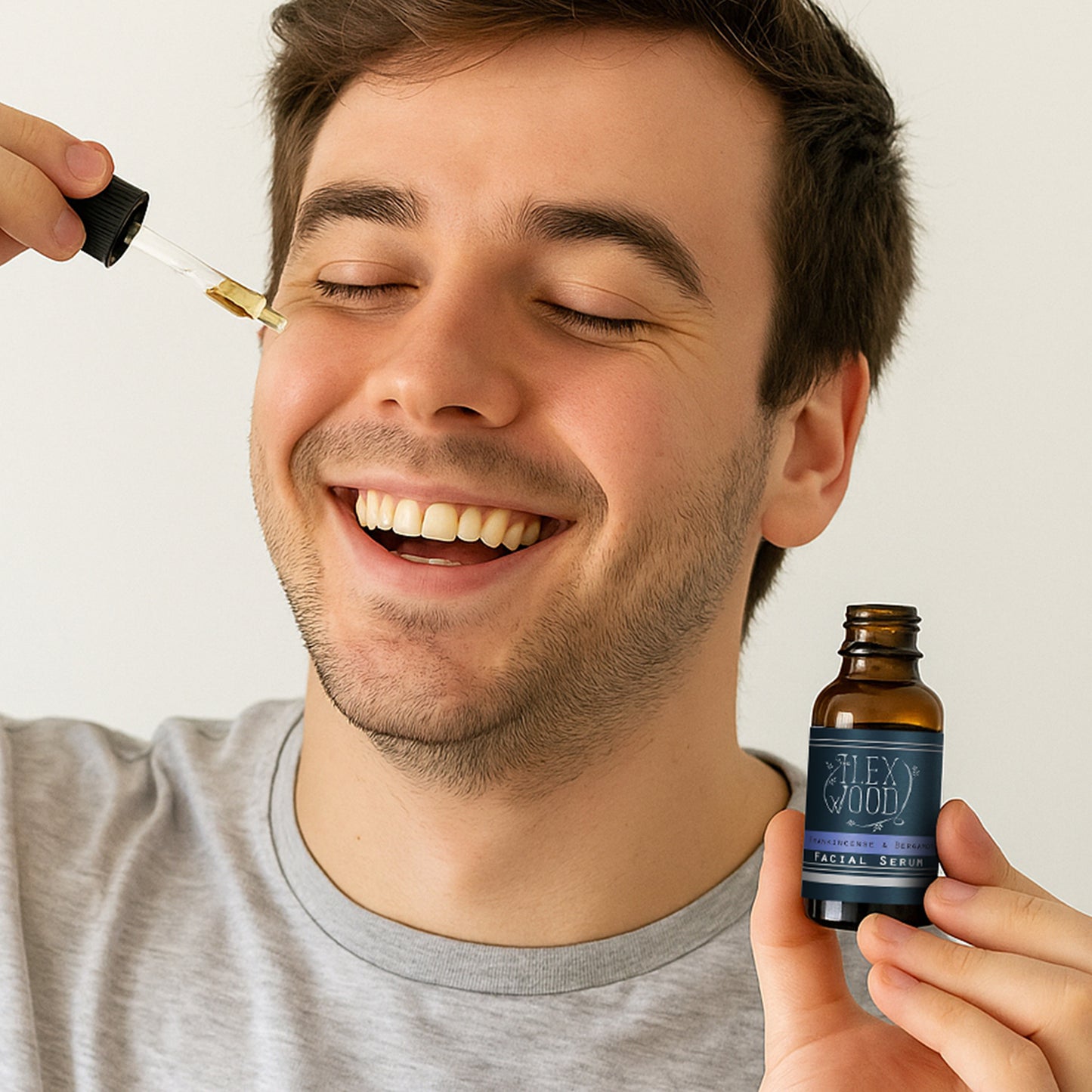 man applying Frankincense and Bergamot Facial serum