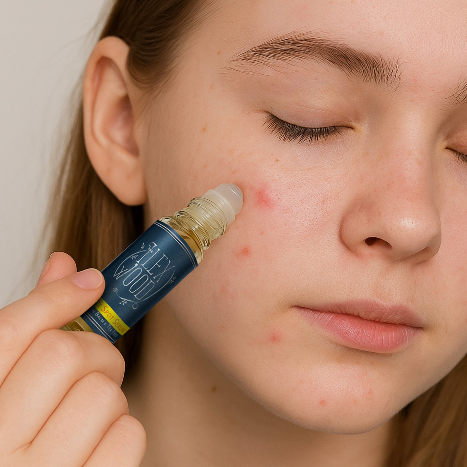 Person applying a spot product to their face